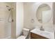 Bathroom features a tub-shower combination and a wooden vanity with a modern sink at 1620 S Ivory Cir # C, Aurora, CO 80017