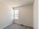 Bright room features neutral paint, carpeting, and a large window at 1620 S Ivory Cir # C, Aurora, CO 80017