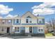 Charming townhouse with blue and beige exterior, well-kept lawn, and inviting curb appeal at 1620 S Ivory Cir # C, Aurora, CO 80017