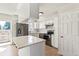 Modern kitchen with stainless steel appliances, quartz counters, and bright white cabinets at 1620 S Ivory Cir # C, Aurora, CO 80017