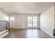 Bright living room featuring wood floors, stairs and natural light at 1620 S Ivory Cir # C, Aurora, CO 80017