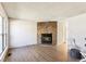A spacious living room with attractive flooring and a stone fireplace at 1620 S Ivory Cir # C, Aurora, CO 80017