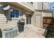 Exterior view of the home's private patio with sliding glass door and storage unit at 1620 S Ivory Cir # C, Aurora, CO 80017