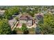 High aerial view showing a house equipped with solar panels in a community with tree-lined streets at 13322 Meadow Park Ln, Broomfield, CO 80020