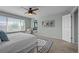 Calm Primary bedroom features a large bed, accent rug, and leads into a private ensuite bathroom at 13322 Meadow Park Ln, Broomfield, CO 80020