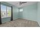 Bright bedroom featuring neutral walls, plush carpet, and natural lighting at 13322 Meadow Park Ln, Broomfield, CO 80020