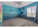 Bedroom with custom art, soft carpet, and plenty of natural light at 13322 Meadow Park Ln, Broomfield, CO 80020