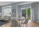 Cozy dining area with a view to the backyard adjacent to a bright living space at 13322 Meadow Park Ln, Broomfield, CO 80020