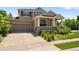 Charming two-story home with a covered front porch, stone accents, and a well-maintained front yard and driveway at 13322 Meadow Park Ln, Broomfield, CO 80020