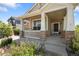 Inviting front porch with stone pillars, a 'Welcome' mat, and well-maintained landscaping at 13322 Meadow Park Ln, Broomfield, CO 80020