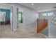 Spacious hallway with neutral tones and natural light, leading to various rooms in the home at 13322 Meadow Park Ln, Broomfield, CO 80020