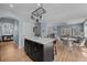 Open floor plan with kitchen island and a dining area adjacent to a living space at 13322 Meadow Park Ln, Broomfield, CO 80020