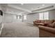 Spacious living room featuring plush carpeting, neutral walls, and recessed lighting at 13322 Meadow Park Ln, Broomfield, CO 80020