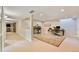 Spacious finished basement with neutral walls, recessed lighting and work areas at 2552 E Alameda Ave # 74, Denver, CO 80209