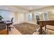 Bright basement space with dual desk and chairs, showcasing storage and natural light at 2552 E Alameda Ave # 74, Denver, CO 80209