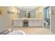 Luxurious bathroom with double vanity, soaking tub and separate toilet room for a spa-like experience at 2552 E Alameda Ave # 74, Denver, CO 80209