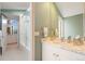 Bathroom showcasing glass shower, and marble countertop with soft natural light at 2552 E Alameda Ave # 74, Denver, CO 80209