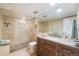 Modern bathroom with a walk-in shower and a granite vanity with ample counter space at 2552 E Alameda Ave # 74, Denver, CO 80209