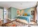 Calming bedroom with hardwood floors, comfortable queen bed, and bright, natural lighting at 2552 E Alameda Ave # 74, Denver, CO 80209