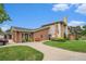 Exterior view of the community clubhouse with a well-manicured lawn and landscaping at 2552 E Alameda Ave # 74, Denver, CO 80209