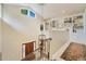 Grand foyer with hardwood floors, high ceilings, leading to the main floor, and a bright, naturally lit stairway at 2552 E Alameda Ave # 74, Denver, CO 80209