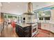 Modern kitchen featuring an island with a cooktop, stainless steel appliances, and plenty of counter space at 2552 E Alameda Ave # 74, Denver, CO 80209