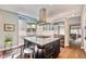 Open concept kitchen with an island, stainless steel appliances, and a view into the living space at 2552 E Alameda Ave # 74, Denver, CO 80209