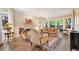 Cozy living room with hardwood floors, a fireplace, comfortable seating, and large windows for natural light at 2552 E Alameda Ave # 74, Denver, CO 80209