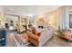 Comfortable living room featuring a fireplace, hardwood floors, stylish furniture, and ample natural light at 2552 E Alameda Ave # 74, Denver, CO 80209