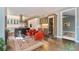 Bright open-concept living space with stainless kitchen appliances and view to an outdoor area at 2552 E Alameda Ave # 74, Denver, CO 80209