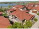 Stunning aerial view of residences with red roofs, close to the serene lake at 2317 Primo Rd # A, Highlands Ranch, CO 80129