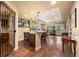 Basement bar area with granite countertops, custom lighting, and open floor plan at 2317 Primo Rd # A, Highlands Ranch, CO 80129