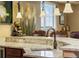 Wet bar featuring granite countertops, seating, pendant lighting and an undermount sink at 2317 Primo Rd # A, Highlands Ranch, CO 80129