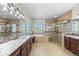 Spacious primary bathroom featuring double sinks, soaking tub, and a glass shower at 2317 Primo Rd # A, Highlands Ranch, CO 80129