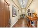 Elegant foyer with gleaming hardwood floors, stylish lighting, and sophisticated decor creates a warm welcome at 2317 Primo Rd # A, Highlands Ranch, CO 80129