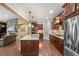 An open-concept kitchen that flows into the living room and dining area at 2317 Primo Rd # A, Highlands Ranch, CO 80129