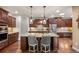This spacious kitchen features granite counters, custom cabinets and stainless steel appliances at 2317 Primo Rd # A, Highlands Ranch, CO 80129