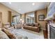Comfortable living room featuring large windows, plush seating, and neutral tones at 2317 Primo Rd # A, Highlands Ranch, CO 80129