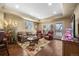 Cozy living room with hardwood floors, a decorative rug, and plenty of natural light at 2317 Primo Rd # A, Highlands Ranch, CO 80129