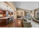 Open-concept living room seamlessly connects to the dining area and kitchen at 2317 Primo Rd # A, Highlands Ranch, CO 80129