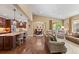 Open living space with hardwood floors, comfortable seating, and seamless flow to the kitchen and dining areas at 2317 Primo Rd # A, Highlands Ranch, CO 80129