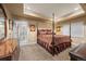 Spacious main bedroom with a decorative bed, neutral carpet, and an ensuite bathroom at 2317 Primo Rd # A, Highlands Ranch, CO 80129