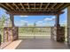 Inviting covered porch with stone pillars and a view of the natural landscape at 2317 Primo Rd # A, Highlands Ranch, CO 80129