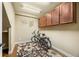 Functional storage room with overhead cabinets and a decorative rug at 2317 Primo Rd # A, Highlands Ranch, CO 80129