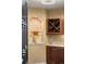 Wine storage room featuring custom shelving and storage space for wine bottles and glasses at 2317 Primo Rd # A, Highlands Ranch, CO 80129