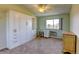 Inviting bedroom featuring built-in storage, desk space, and large windows for plenty of natural light at 9180 E Center Ave # 9D, Denver, CO 80247