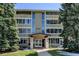 Inviting condominium with well-maintained landscaping and covered entrance in a serene residential area at 9180 E Center Ave # 9D, Denver, CO 80247