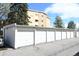 A row of private garages in front of the apartment complex for residents' parking and extra storage at 9180 E Center Ave # 9D, Denver, CO 80247