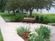 Relaxing bench within beautiful landscaping, enhancing the community's outdoor appeal at 9180 E Center Ave # 9D, Denver, CO 80247