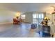 Open-concept living room with hardwood floors, natural light, and access to a covered patio at 9180 E Center Ave # 9D, Denver, CO 80247
